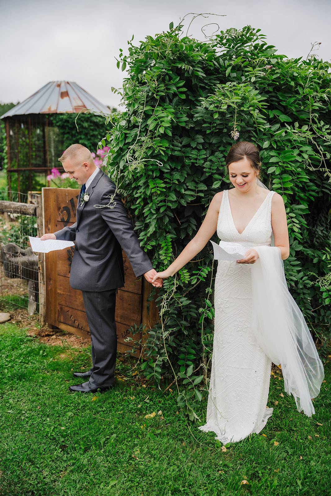 Bride and groom share letters with each other before their apple orchard wedding ceremony. Spring Wisconsin wedding First look Love letters#dixonappleorchard #orchardweddingvenue #outdoorwedding #appleorchardwedding #wisconsinweddingvenue