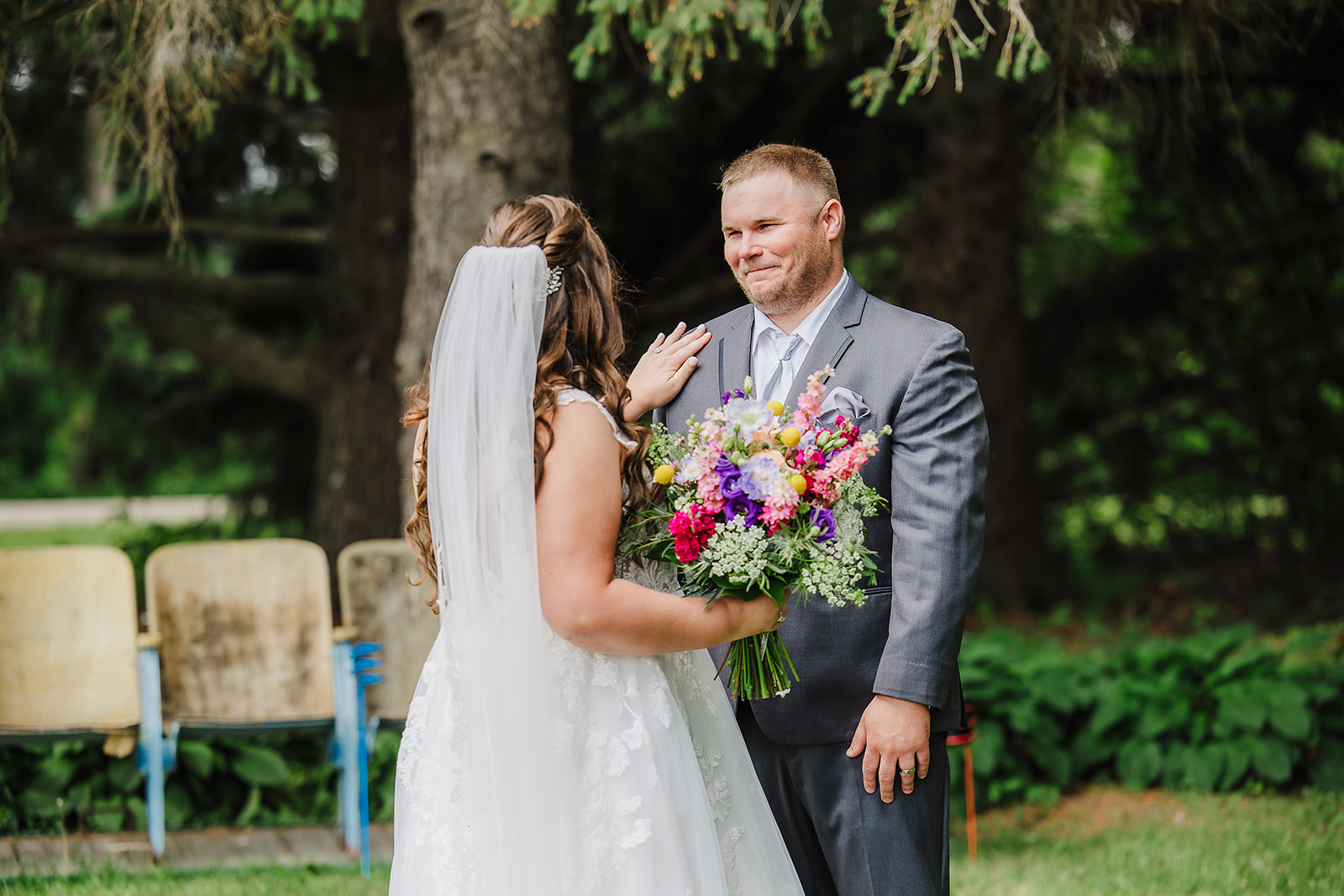 First look photos are full of so much emotion and joy, such as this Wisconsin groom’s first look with his bride. Colorful wedding bouquet First look photos #firstlook #firstlookinspo #wisconsinwedding #wisconsinweddingphotographer #brideandgroomphotos