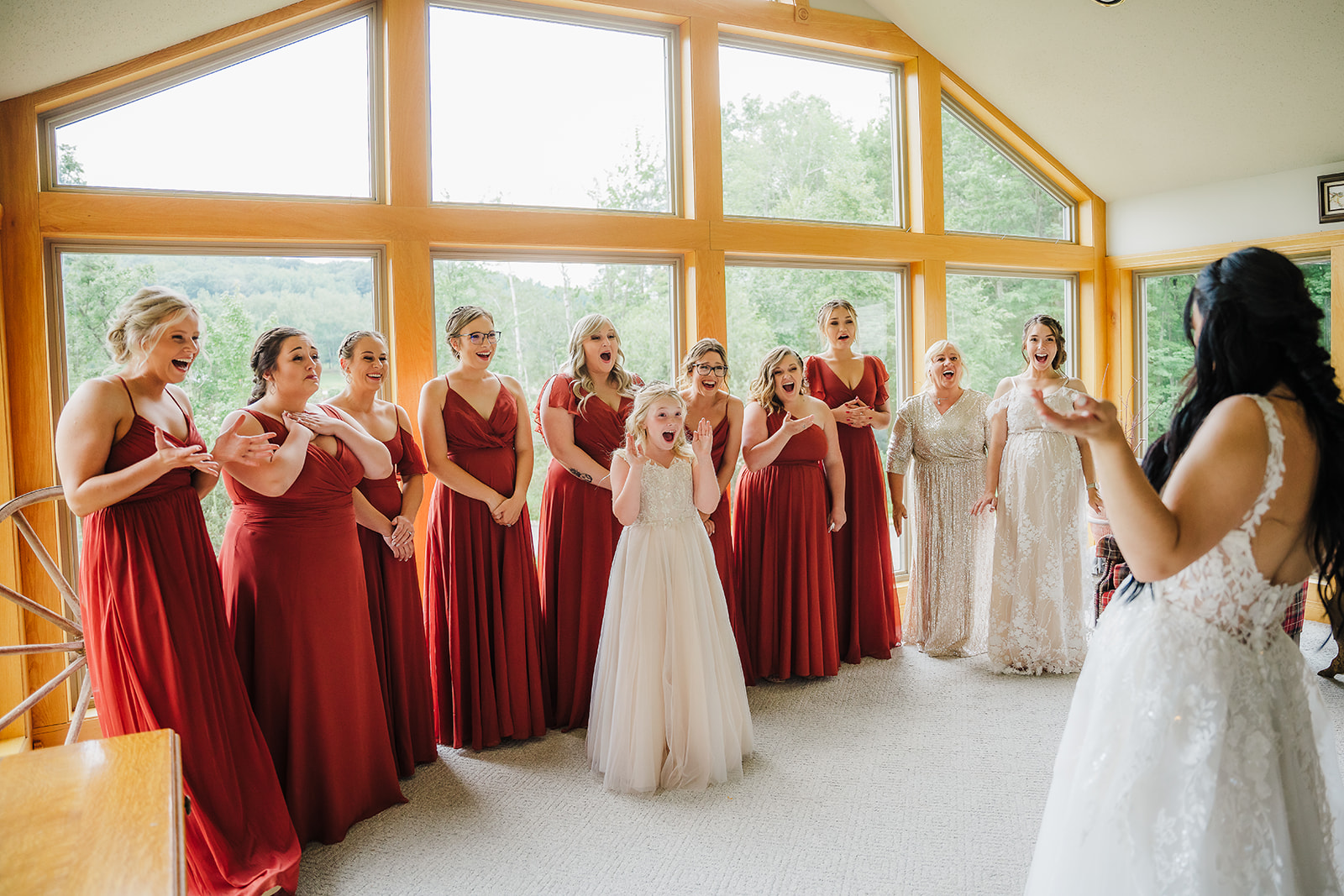 The flower girl and bridesmaids are so excited to see this beautiful Wisconsin bride’s dress reveal. First look Bridal party photos Getting ready photos Chippewa valley bride #dixonappleorchard #orchardweddingvenue #outdoorwedding #appleorchardwedding #wisconsinweddingvenue
